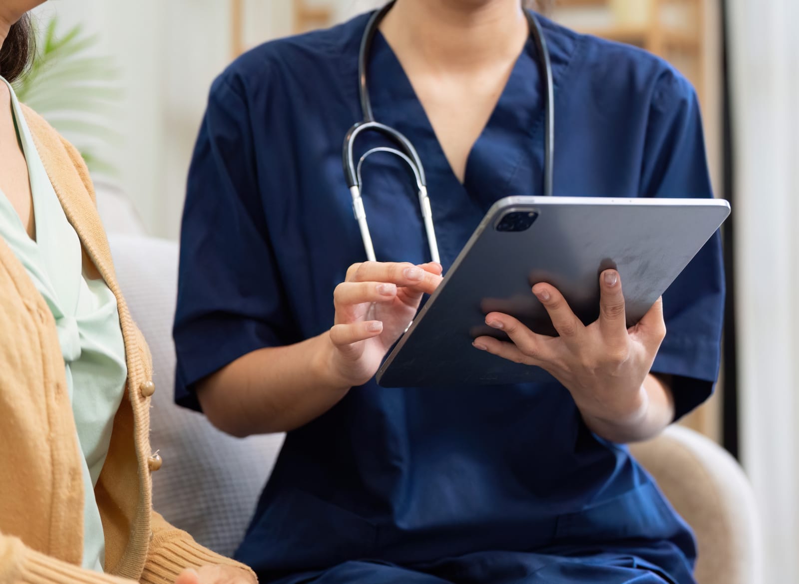 Healthcare provider focused on patient care with PhoxNote handling documentation