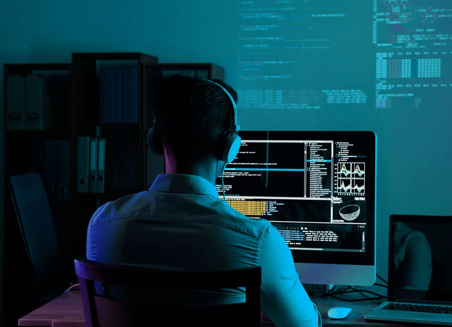 A developer at a screen of code