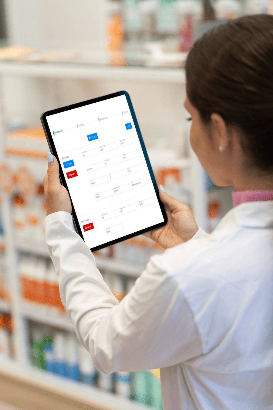 A pharmacist filling in a special authorization form on a tablet