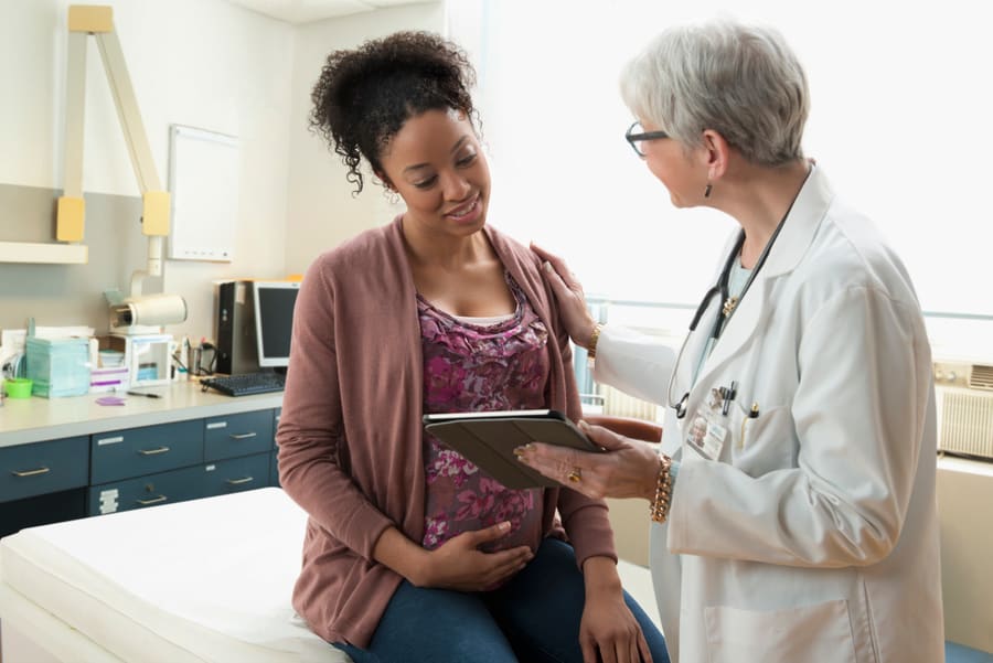 A pharmacist talking a patient through a care programme