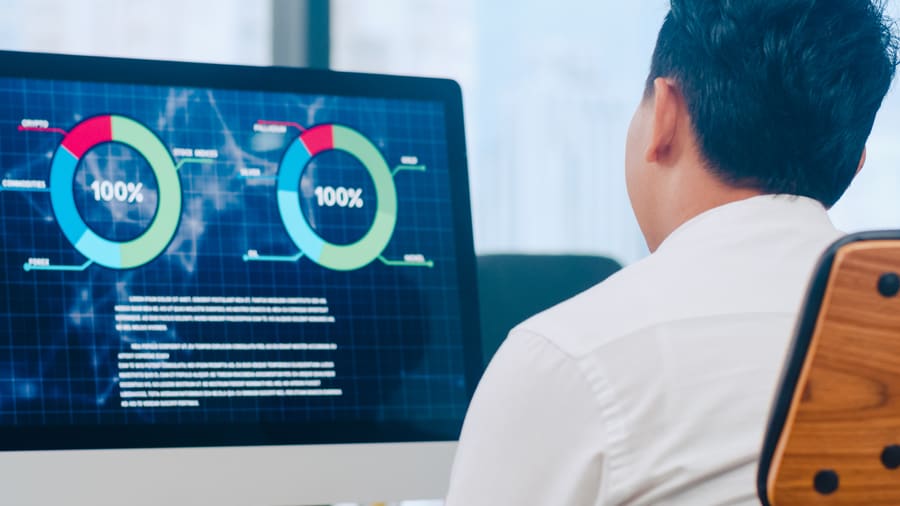 Someone reading an analytics dashboard on a large screen