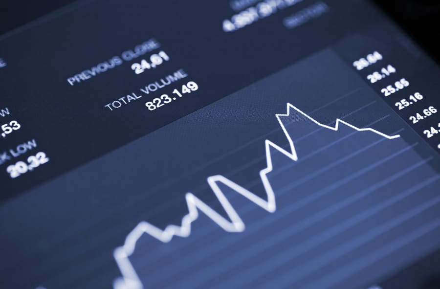 A rising volume trend line on a dark analytics screen